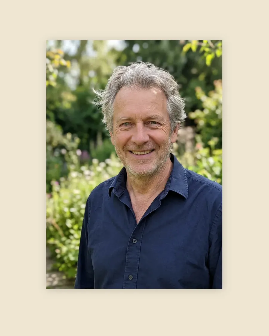 Poster, A2 shown: an unframed sheet of 250 gsm uncoated off-white paper printed with an AI-made example photo of a smiling grey-haired man in a blue shirt in a garden.